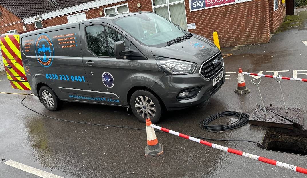 JD Drainage Solutions van on site attending a drainage job